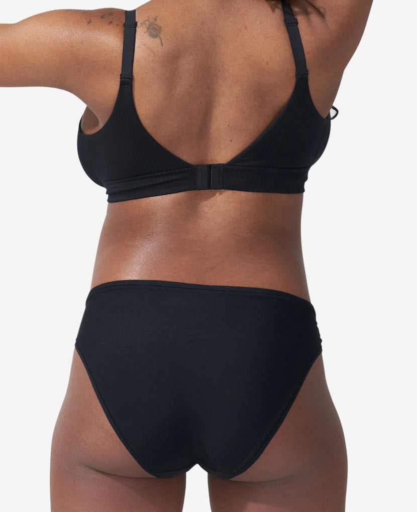 Designed with a flattering cut offering a balance between coverage and cheek. Shown in Black/Clay.
