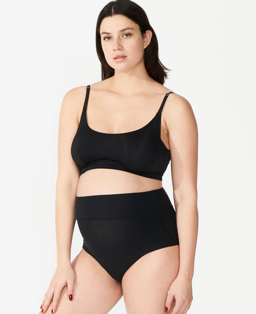 Wide band elastic waist is high enough to stay put on a pregnancy bump or healing core while covering a C-section incision without rubbing. Nicole, size 6 pre-pregnancy and 36 weeks pregnant, wears a Medium. Shown in Black.