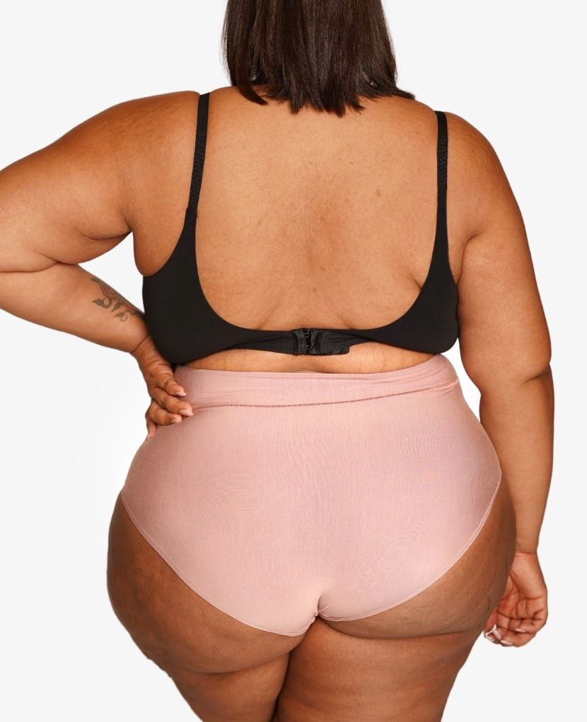 High-waisted to help a core in transition. Model wears size 20 and is a size 2X. Available in Pacific, Dusk, Grey, Clay, & Ember.