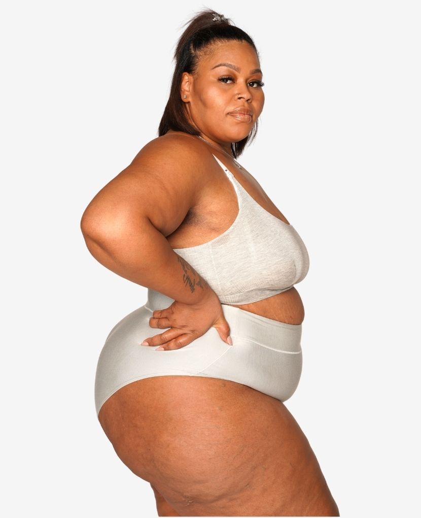 Craveably comfortable high-waisted support designed for pregnancy through postpartum – that you'll want to wear well beyond. Diamond, wears size 2X. Shown in Black/Clay/Grey.