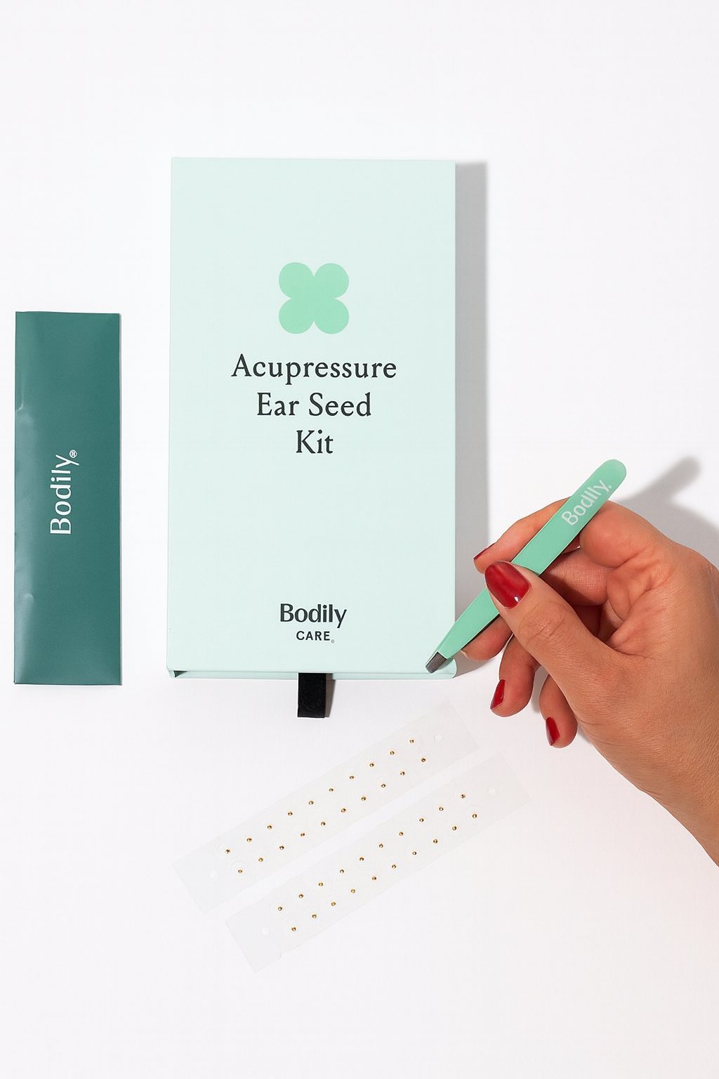 Includes 40 acupressure ear seeds, a precision tweezer, and a simple application guide.