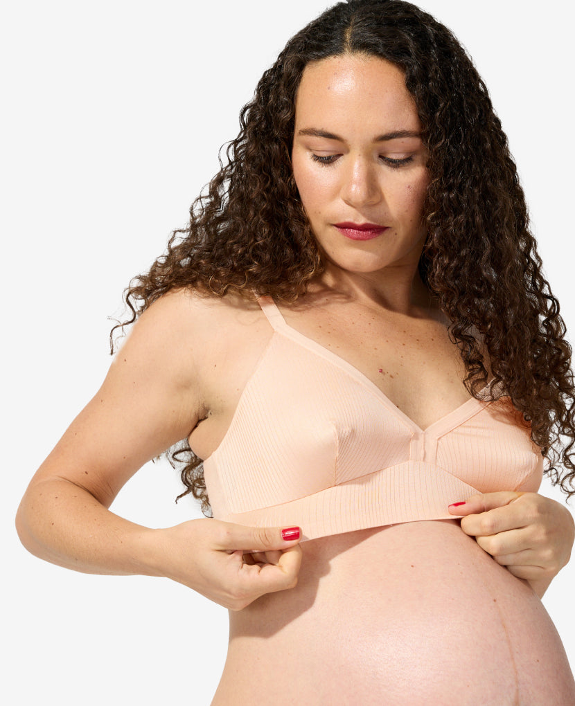 Ultra-stretchy fabric moves with your body and is incredibly soft on sensitive nipples and skin. Alessandra is 36 weeks pregnant and wears a size S. Shown in Clay.