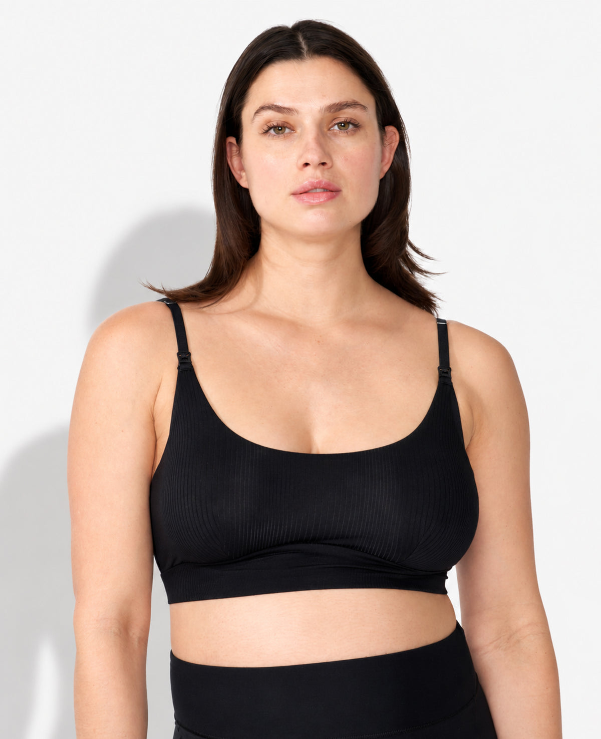 Pregnant model wearing a black clip down nursing bra, labeled as Nicole, 8 months pregnant, 36B, size medium. Shown in Black.