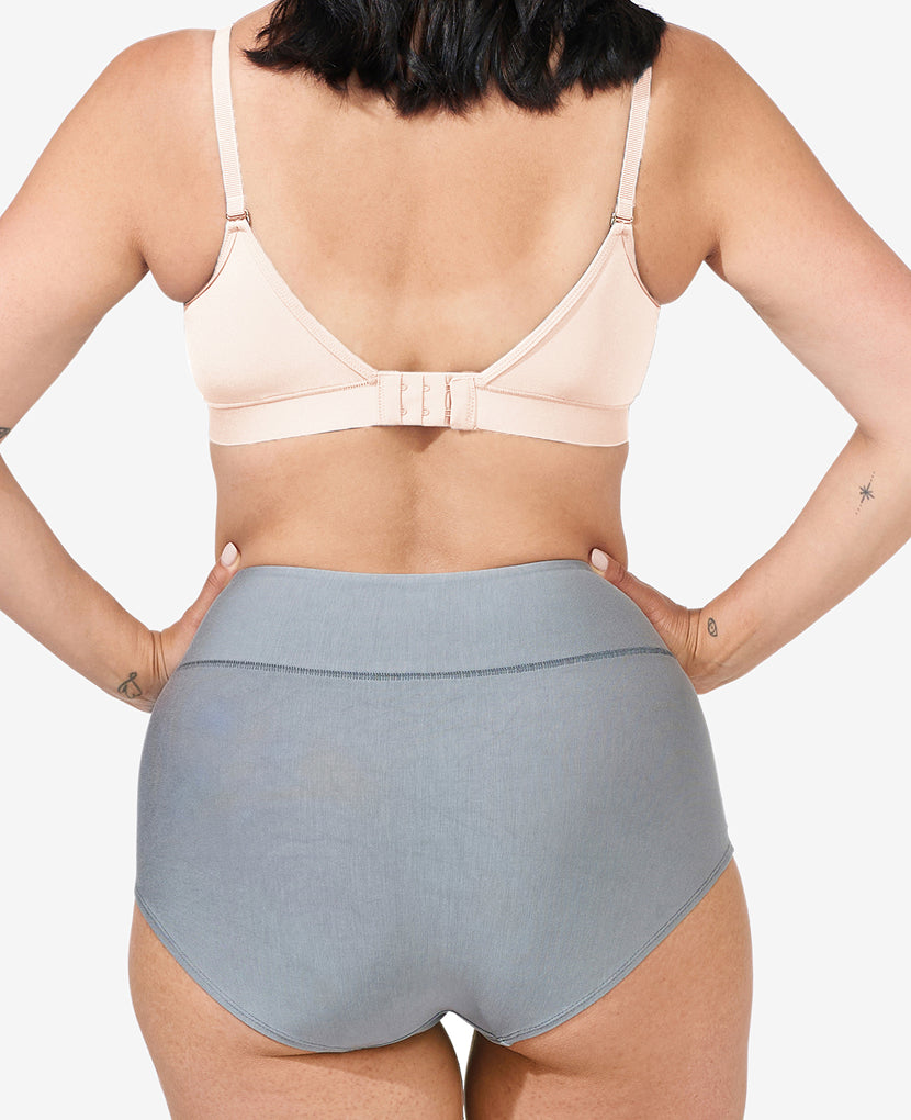 Person wearing a beige bra and gray high-waisted underwear on a plain background Black/Dusk/Slate