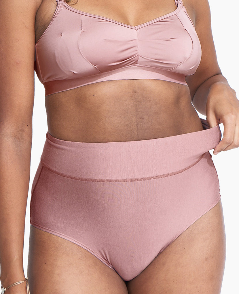 Person wearing a pink high wasted underwear set on a plain background  in Black/Dusk/Slate
