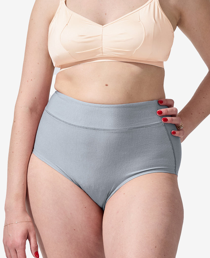 Person wearing a light pink bikini top and gray high-waisted bikini bottom on a white background in Clay/Dusk/Grey