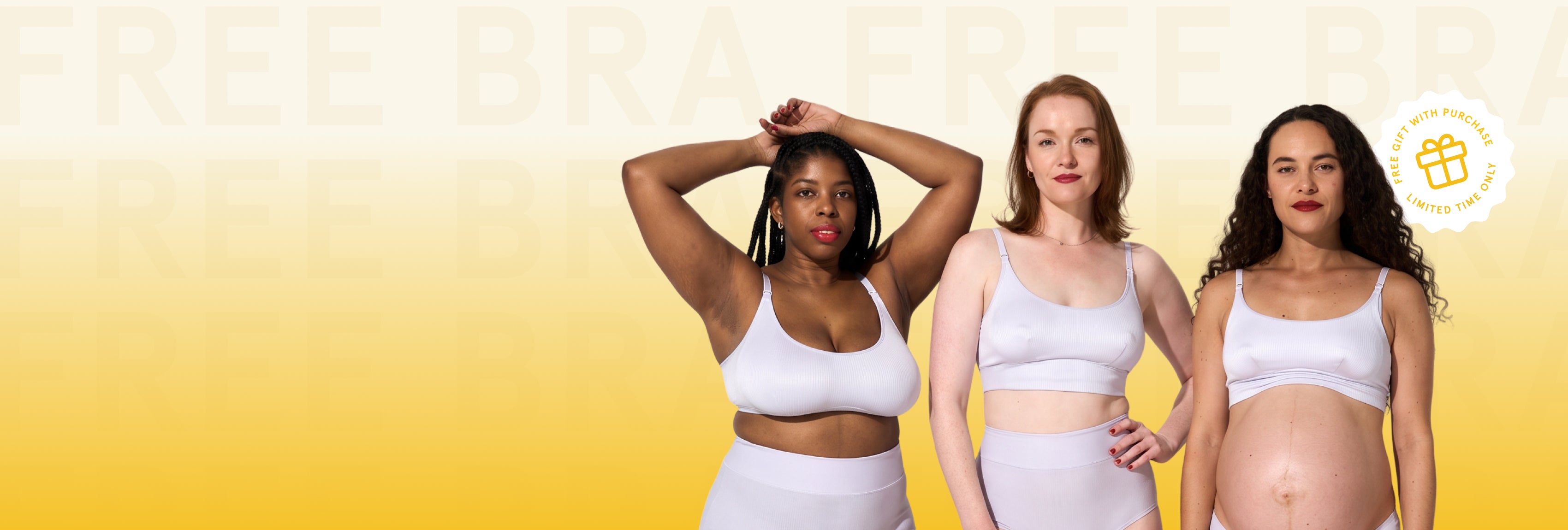 Three women wearing white sports bra and maternity/crop top sets standing against a yellow gradient background with faint text reading 'FREE BRAZEN BREAST' and a small circular badge in the top right.