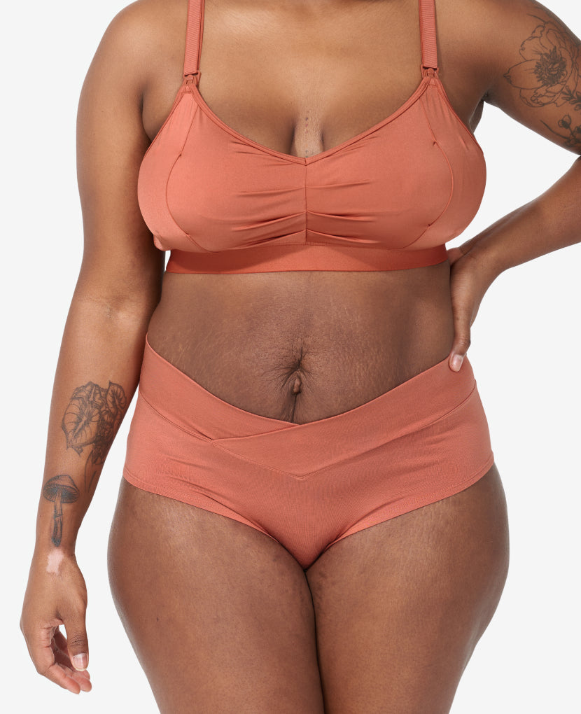 The Embrace Crossover Panty is craveably soft with a flattering crossover style. SaVonne, size 8 and 8 months postpartum, wears size M in Sandstone. Available in Sandstone/Moon/String.