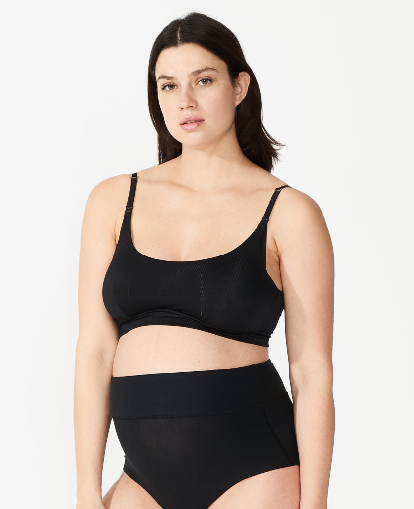 The Everything Bra. Named “Best Maternity Bra” by InStyle, this Stage 1 pregnancy-through-postpartum bra – with clip-down easy nursing access – is the ultimate in comfort. Nicole, size 36DD, wears a size L. Shown in Black.