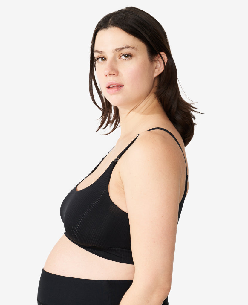 Named “Most Comfortable Nursing Sleep Bra” by WhatToExpect, it was developed with an IBCLC to optimize breast health, even in Stage 1, when the risk is highest for breastfeeding complications. Nicole, 36 weeks pregnant, wears a L in The Everything Bra, Black.