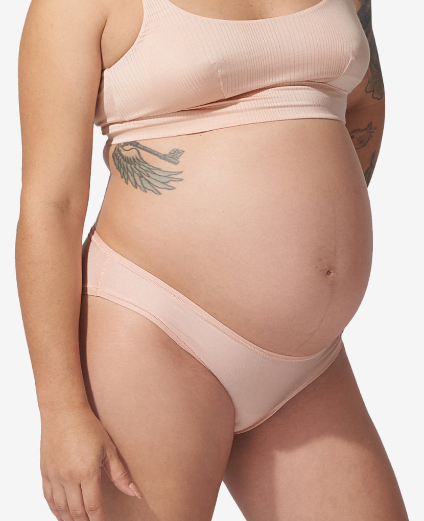 The low-rise cut perfectly accommodates your growing belly—even throughout the third trimester. Shown in Clay.