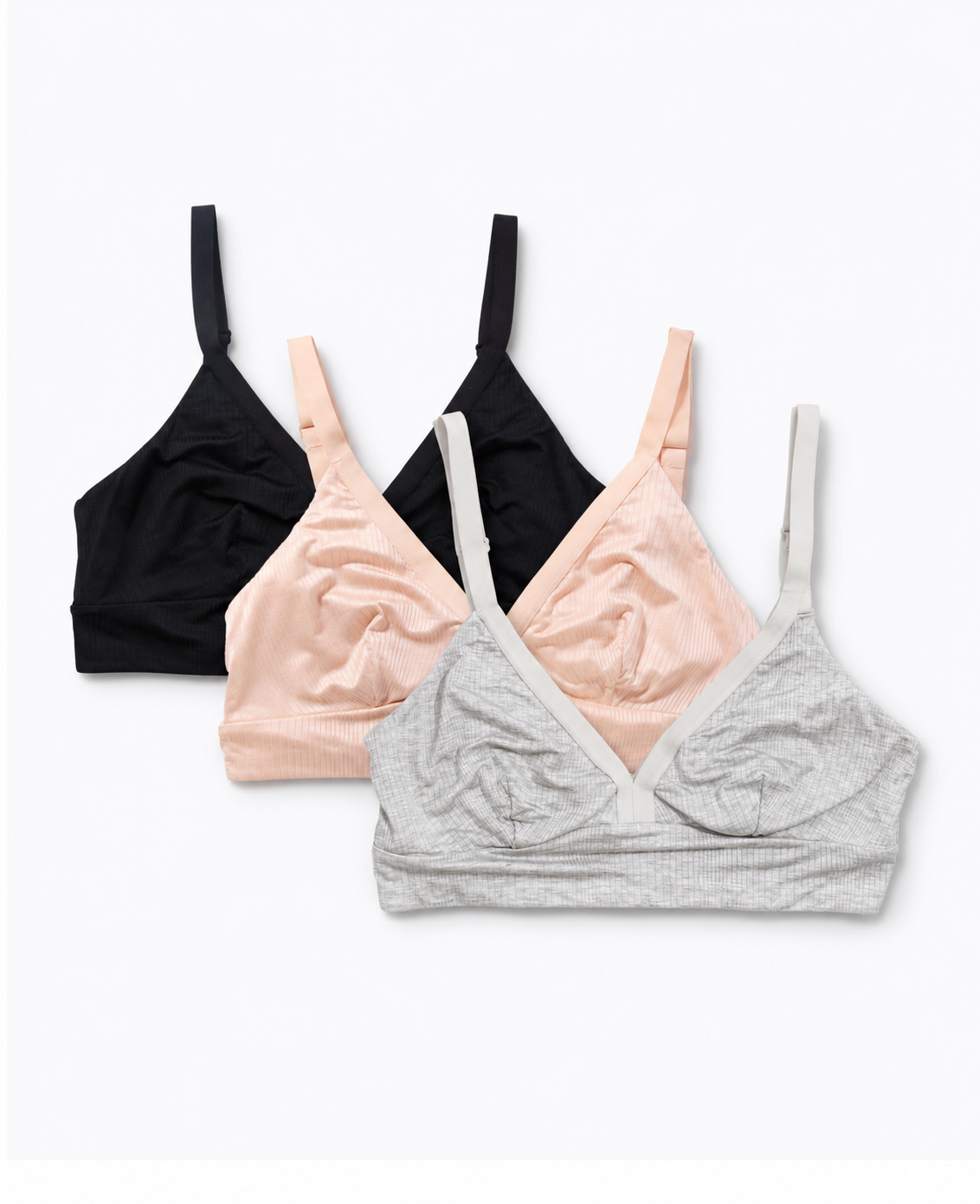 he Effortless Bra: 3-Pack • Save 15%, showcasing stylish and comfortable grey marl, clay, and black nursing bras for postpartum wear.