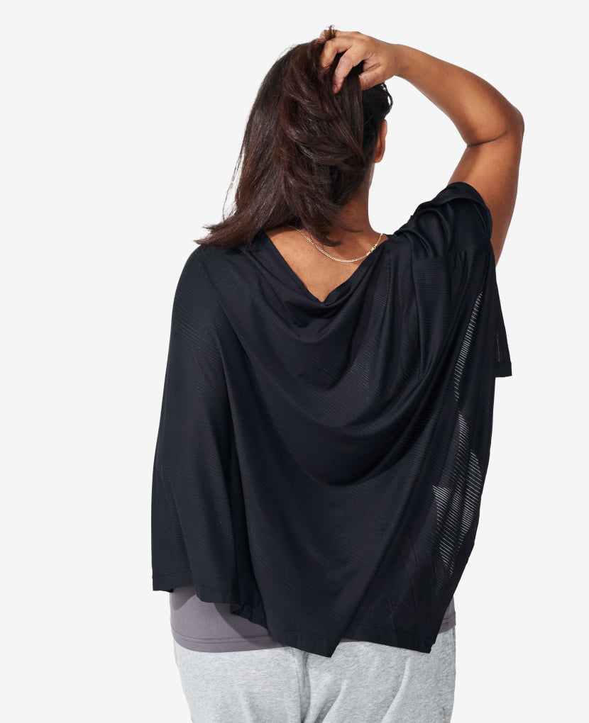 Features a modern asymmetrical hem to uplevel your everyday. Taira wears the Everything Cover in Black.