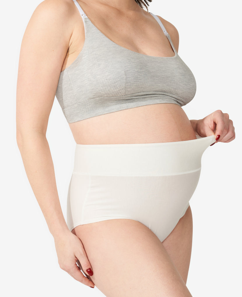 Wide band elastic waist is high enough to gently hug a pregnancy bump or healing core while covering a C-section incision without rubbing. Nicole, size 6 pre-pregnancy and 36 weeks pregnant, wears a Medium. Available in Chalk/Black/Slate.