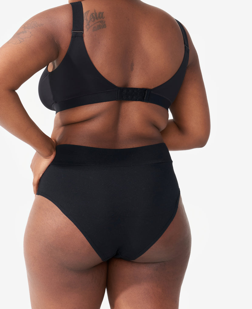 Postpartum support that feels more like a pre-pregnancy panty, with a cheeky rear and a wide gusset, which comfortably holds a maxi pad. SaVonne wears a Medium in Black.