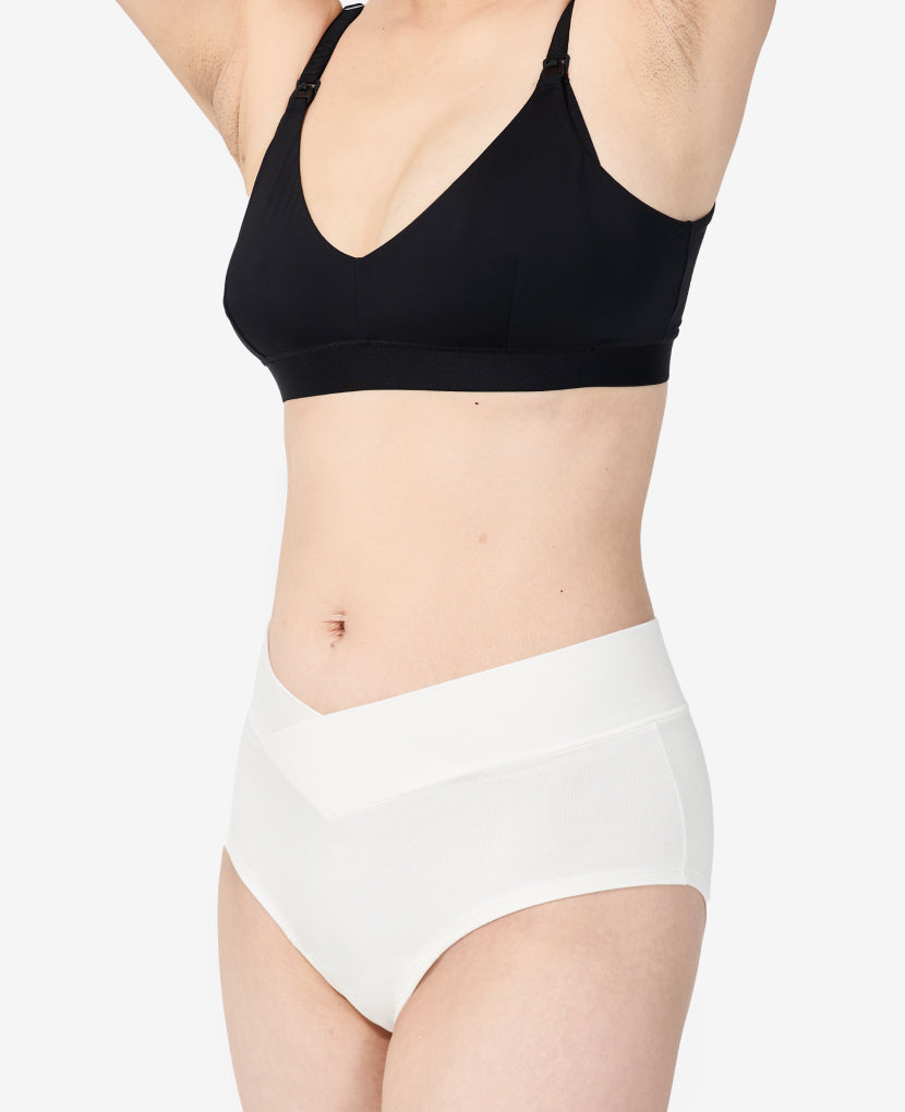 Elastic-free waistband can be worn higher on hips for a cheekier rear, or lower on hips for a more subtle V.  Mid-rise comfortably clears a C-section incision. Ara wears a Small in Chalk.