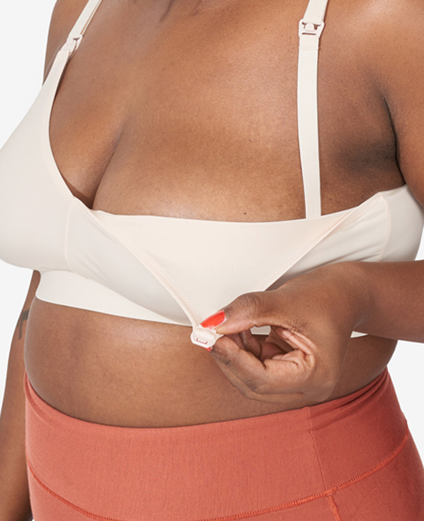 All our clip-down styles offer easy one-handed nursing access. Tahirah,  38D, wears size Large in Shell.