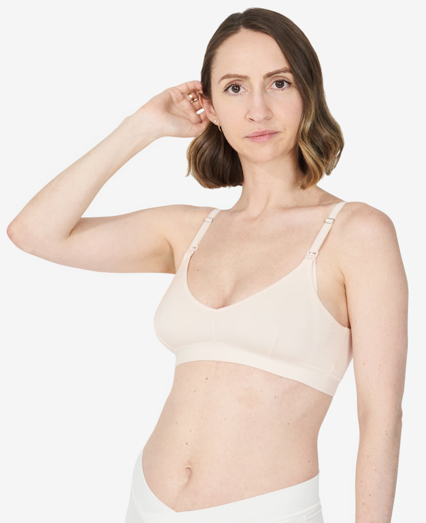 A t-shirt bra design with clip-down nursing access features light support and a sleek style to let you get back to feeling like you. Nora, size 34C, wears a S in Shell.