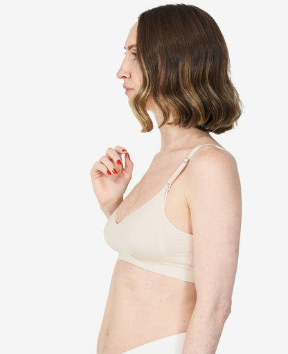 Developed with an IBCLC, this versatile bra prioritizes breast health while re-introducing a bit of structure. Nora wears a S in Shell.
