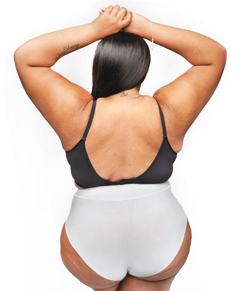 Extended back closure to accommodate changes in cup and band size as you move through pregnancy and postpartum. Image of the Black Do Anything Bra back. 
