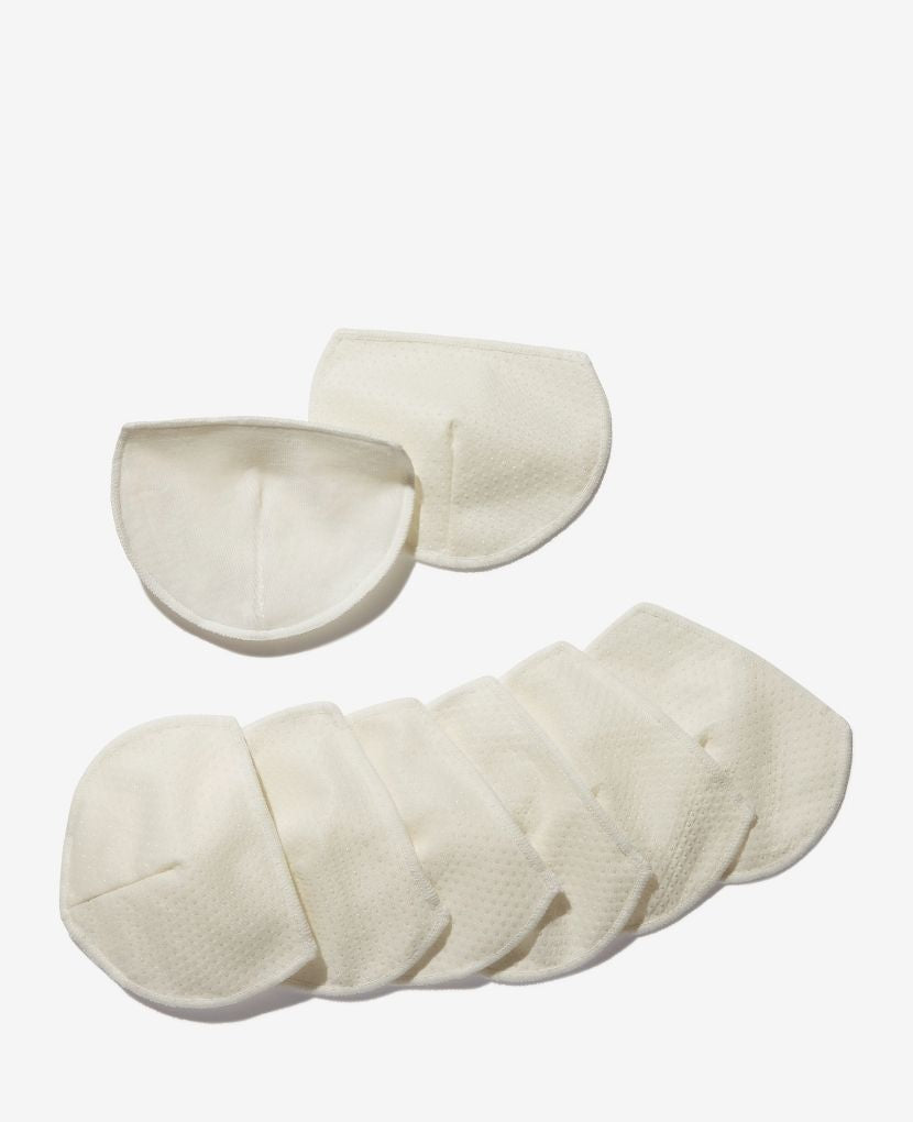 With their grippy silicone dots, eco-friendly bamboo velvet interior, and unique semi-circle shape, these reusable Non-Slip Low Profile Breast Pads stay put in your bra and do their job without making themselves known.
