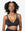 Meet the So Easy Bra in Black. Sleek design, subtle support, and smooth fabric. Yanni is size 34DD and wears a size Medium.